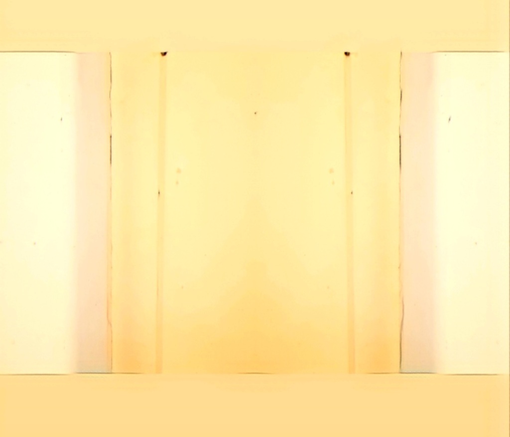 An altered photo of a panel of pale ocher yellow wainscoting.