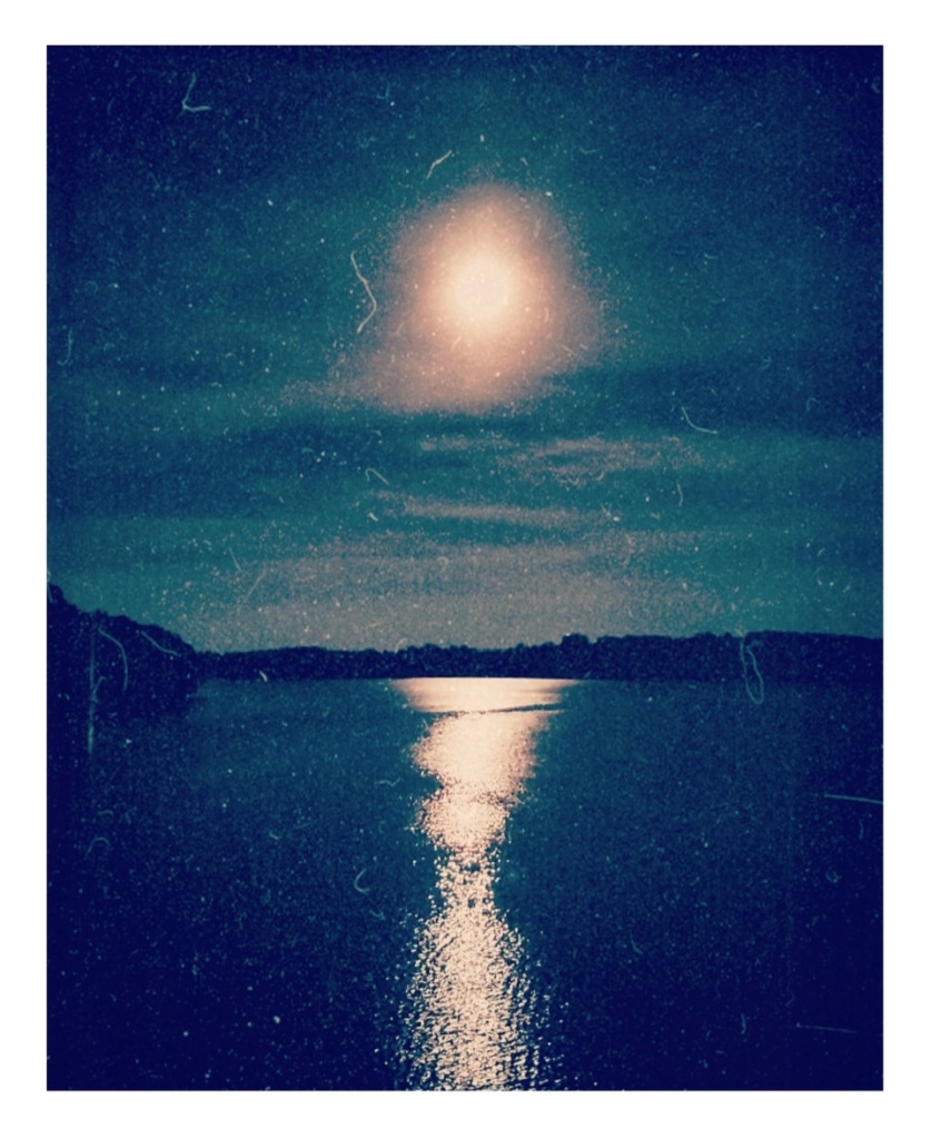 An artfully altered personal photo of the full Hunter's Moon, reflecting over our nearby reservoir.